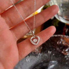 Detailed view of the Sterling Silver Simple Beating Heart Necklace chain and pendant