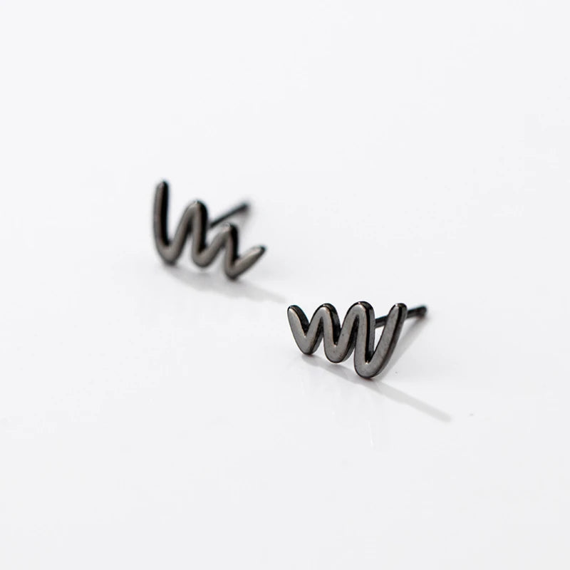 Angled view of the Sterling Silver Simple Glossy Wave Stud Earrings