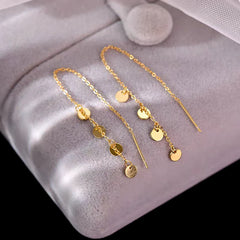 Angled view of the Sterling Silver Small Disc Tassel Threader Earrings