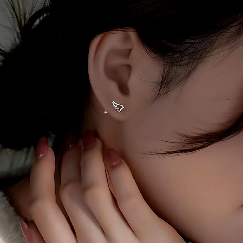 Close-up detail of the sparkling zircons and plating on the Wing Screw Back Earrings