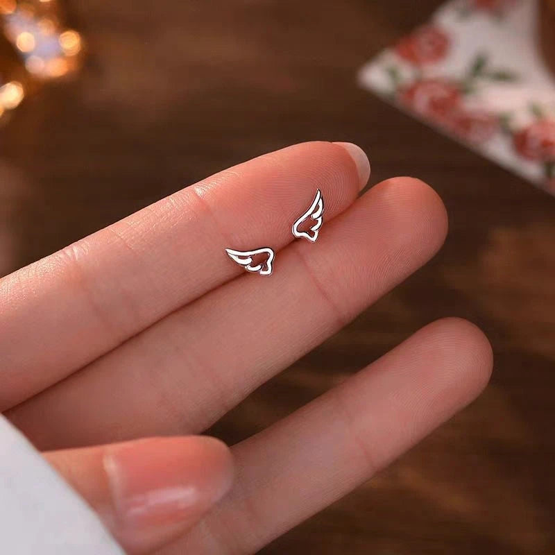 Angled view of the Sterling Silver Small Wing Screw Earrings