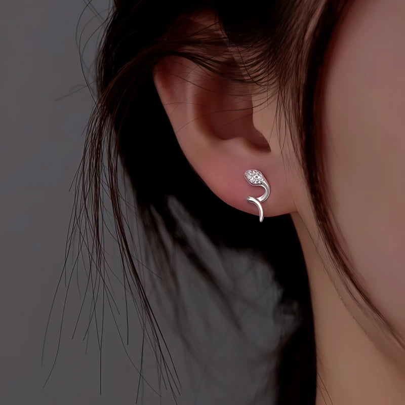 Model showcasing the dangle and style of the Sterling Silver Snake Stud Earrings