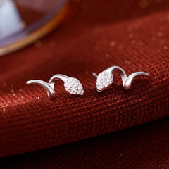 Angled view of the Sterling Silver Snake Stud Earrings