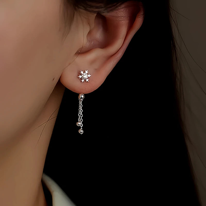 Model showcasing the dangle and style of the Sterling Silver Snowflake Jacket Earrings