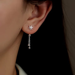 Model showcasing the dangle and style of the Sterling Silver Snowflake Jacket Earrings
