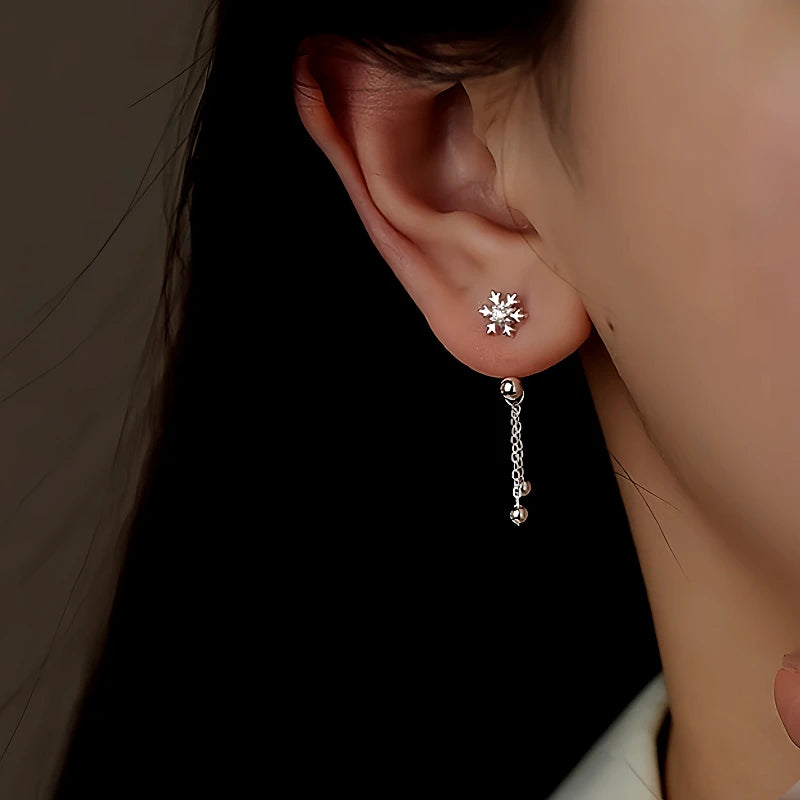 Close-up detail of the sparkling zircons and plating on the Snowflake Ear Jackets