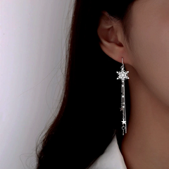 Close-up detail of the sparkling zircons and plating on the Snowflake Threader Earrings