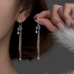 Model showcasing the dangle and style of the Sterling Silver Space Star Threader Tassel Earrings