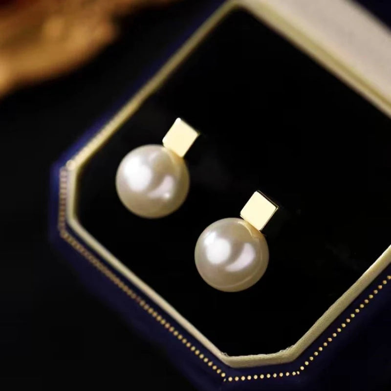 Angled view of the Sterling Silver Square Pearl Earrings
