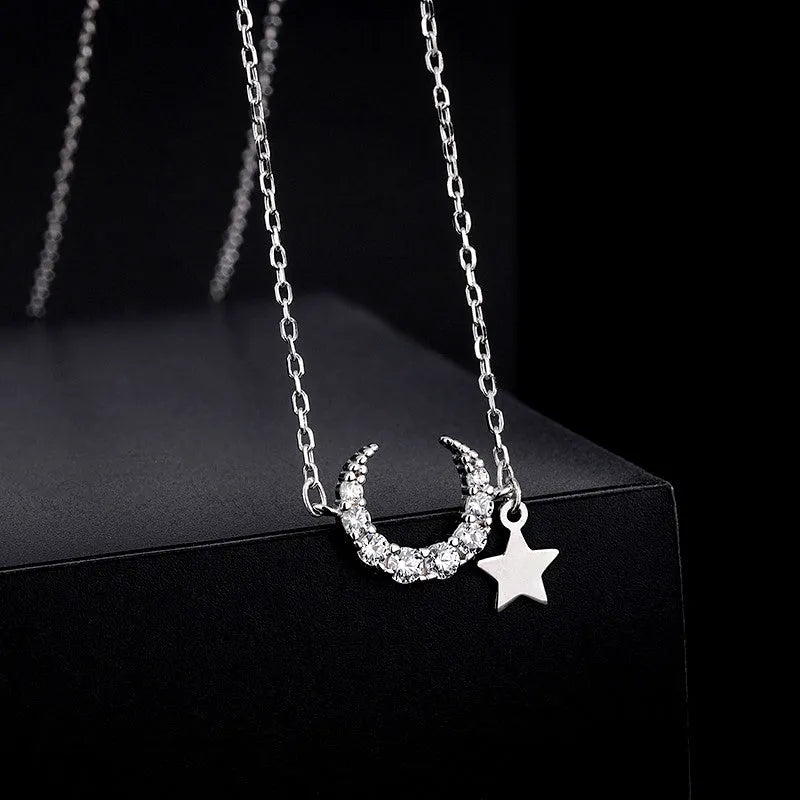 Close-up of the pendant and clasp on the Star and Moon Necklace