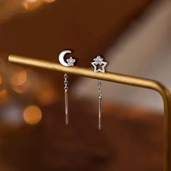 Model showcasing the dangle and style of the Sterling Silver Star And Moon Threader Earrings