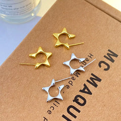 Model showcasing the dangle and style of the Sterling Silver Star Earrings