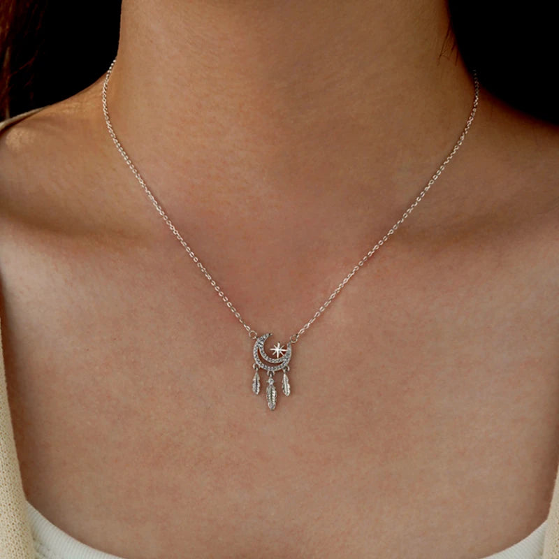 Close-up of the pendant and clasp on the Feather Moon Necklace