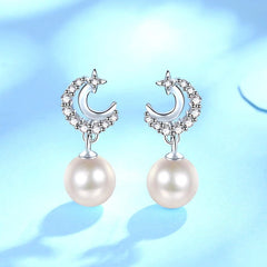 Close-up detail of the sparkling zircons and plating on the Moon and Pearl Earrings