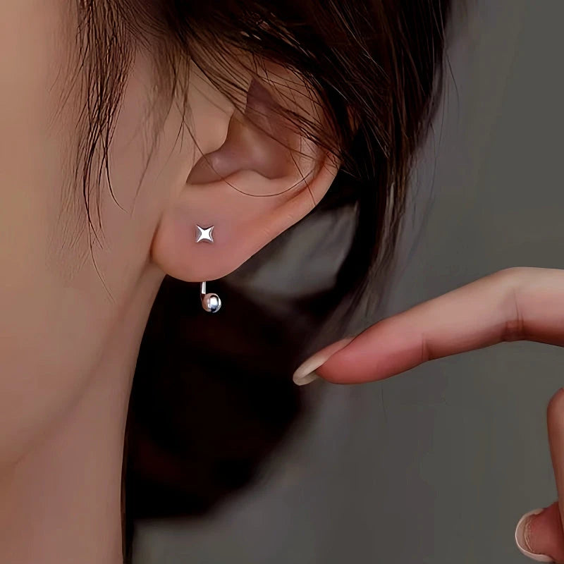 Model showcasing the dangle and style of the Sterling Silver Star Round Bead Earring