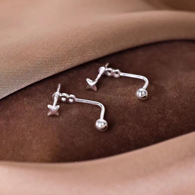 Close-up detail of the sparkling zircons and plating on the Star Ear Jackets