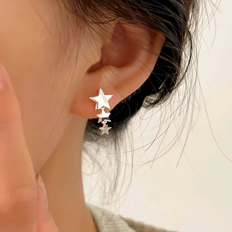 Close-up detail of the sparkling zircons and plating on the Star Tassel Earrings