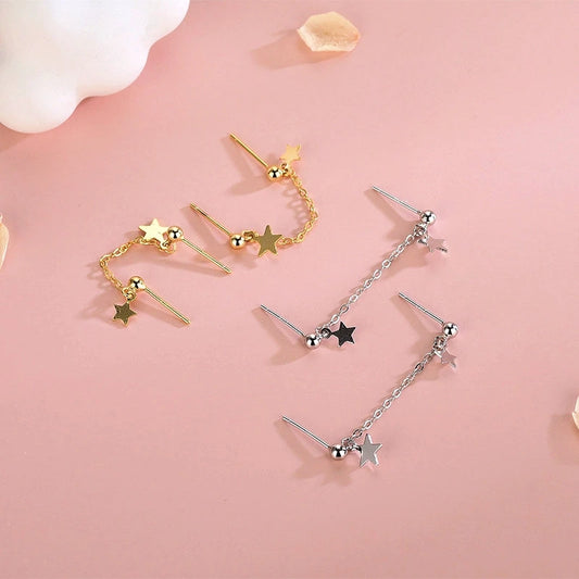 Model showcasing the dangle and style of the Sterling Silver Star Tassel Earrings