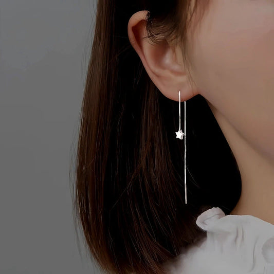 Model showcasing the dangle and style of the Sterling Silver Star Threader Earrings