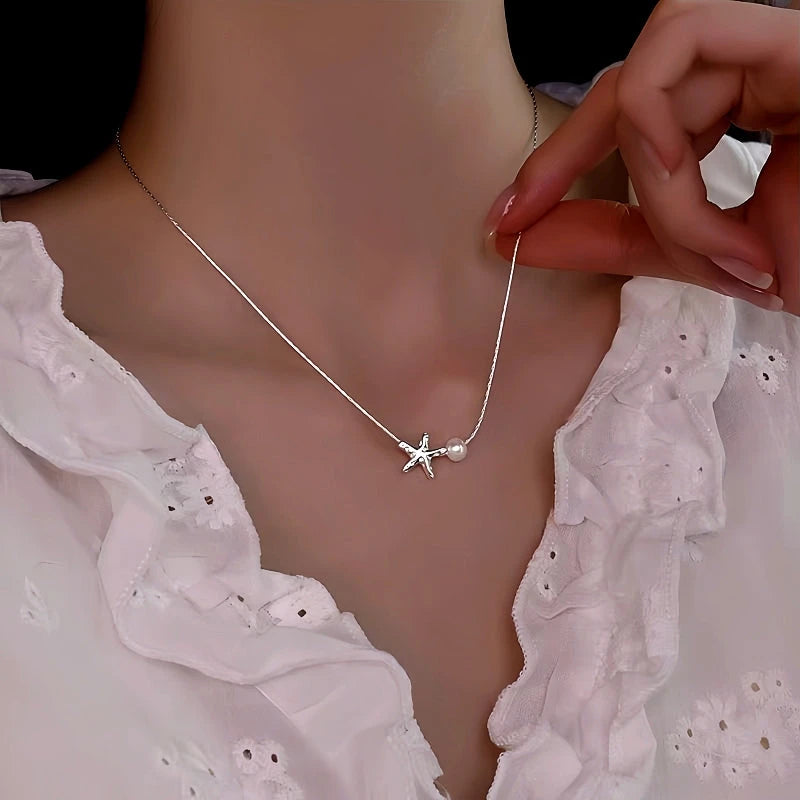 Sterling Silver Starfish Natural Pearl Necklace worn to showcase its length and pendant detail