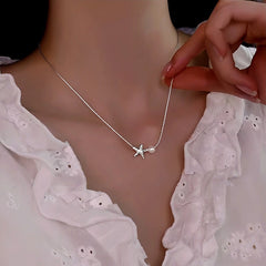 Sterling Silver Starfish Natural Pearl Necklace worn to showcase its length and pendant detail