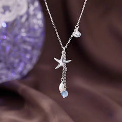 Sterling Silver Starfish Shell Natural Pearl Necklace worn to showcase its length and pendant detail