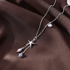 Detailed view of the Sterling Silver Starfish Shell Natural Pearl Necklace chain and pendant