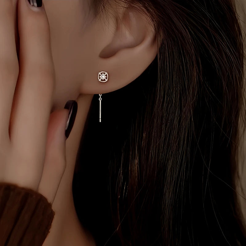 Close-up detail of the sparkling zircons and plating on the Sun Threader Earrings