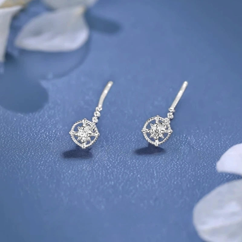 Model showcasing the dangle and style of the Sterling Silver Sun Threader Earrings