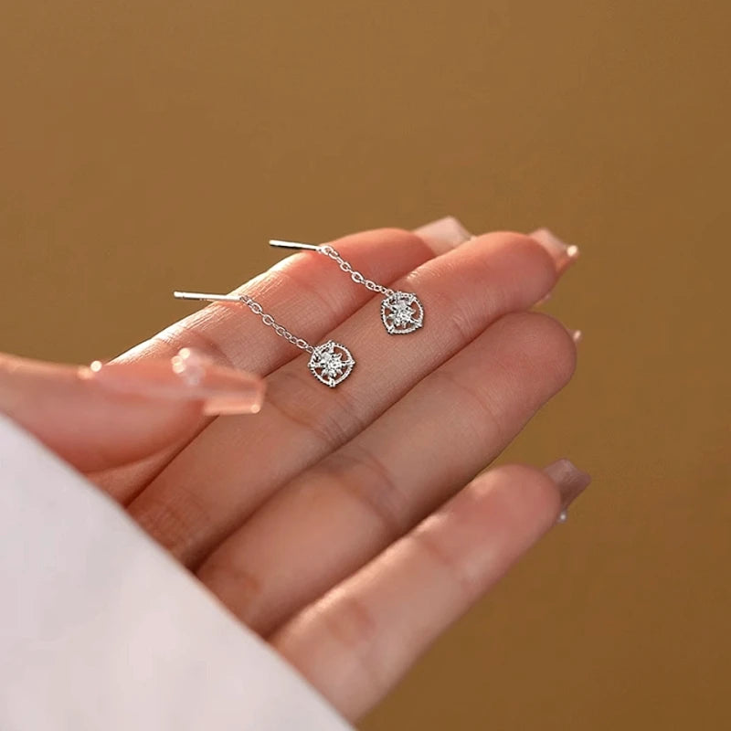 Angled view of the Sterling Silver Sun Threader Earrings
