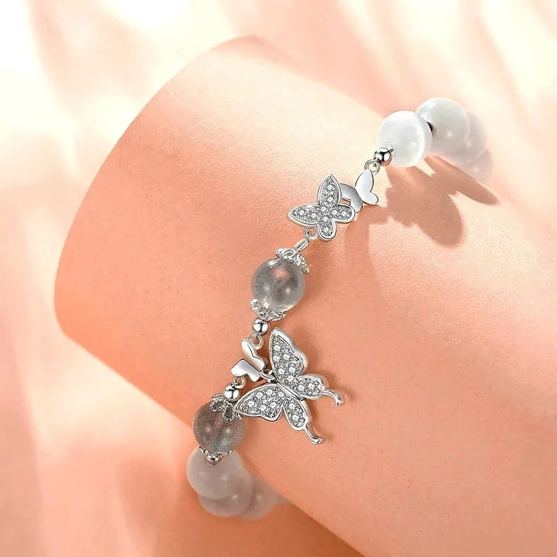 Model wearing the Sterling Silver Swallowtail Butterfly Bead Bracelet to highlight its design on the wrist