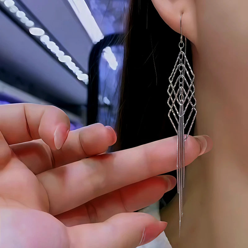Close-up detail of the sparkling zircons and plating on the Tassel Threader Earrings