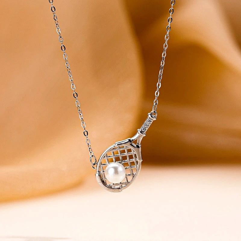 Detailed view of the Sterling Silver Tennis Racket Pearl Necklaces chain and pendant