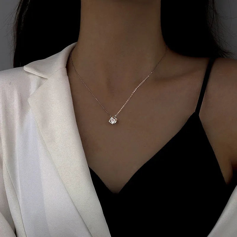 Sterling Silver Three-Dimensional Hollow Cube Necklace worn to showcase its length and pendant detail