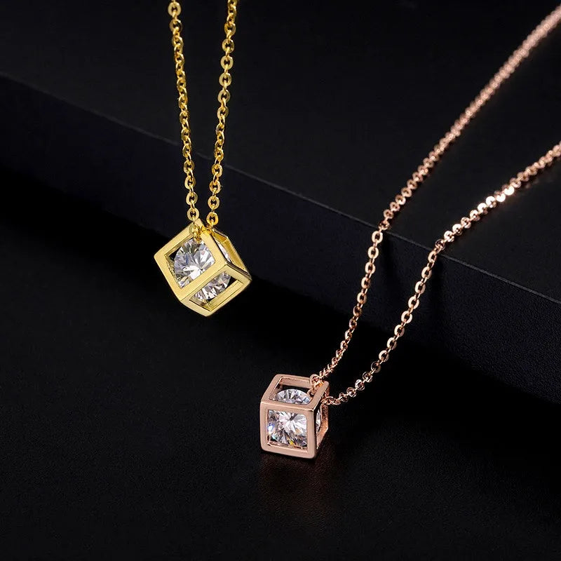 Close-up of the pendant and clasp on the Hollow Cube Necklace