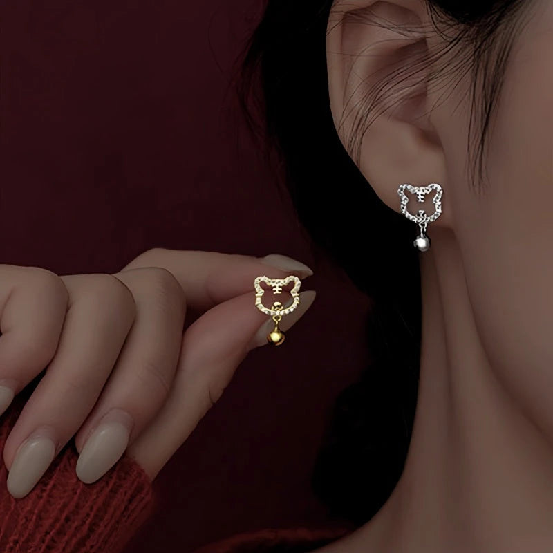 Detailed view of the sparkling accents on the Silver Tiger Earrings