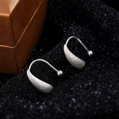 Model showcasing the dangle and style of the Sterling Silver Water Drop Earrings