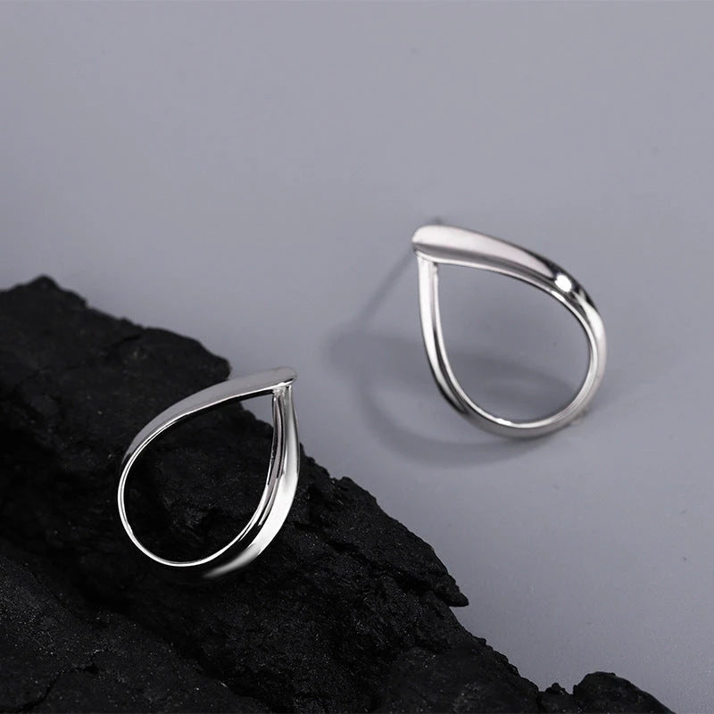 Model showcasing the dangle and style of the Sterling Silver Water Drop Earrings