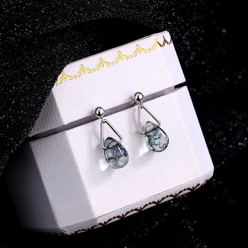 Angled view of the Sterling Silver Water Drop Earrings