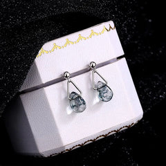 Angled view of the Sterling Silver Water Drop Earrings