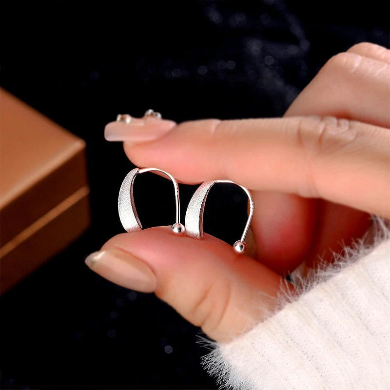 Angled view of the Sterling Silver Water Drop Earrings