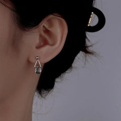 Model showcasing the dangle and style of the Sterling Silver Water Drop Earrings