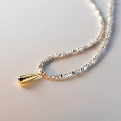 Detailed view of the Sterling Silver Water Drop Earrings chain and pendant