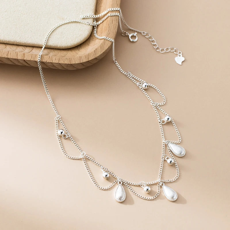 Sterling Silver Water Drop Necklace worn to showcase its length and pendant detail