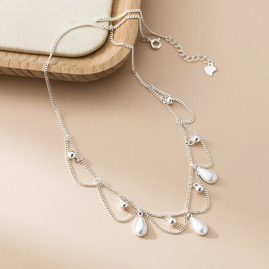 Sterling Silver Water Drop Necklace worn to showcase its length and pendant detail