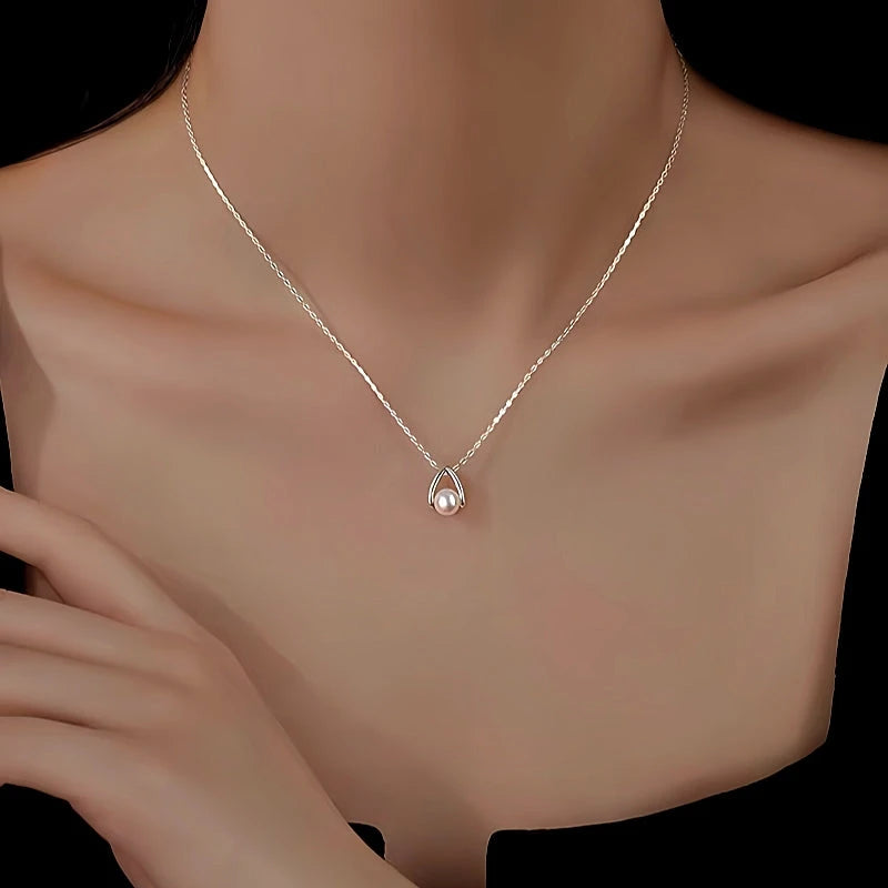 Close-up of the pendant and clasp on the Split Pearl Necklace