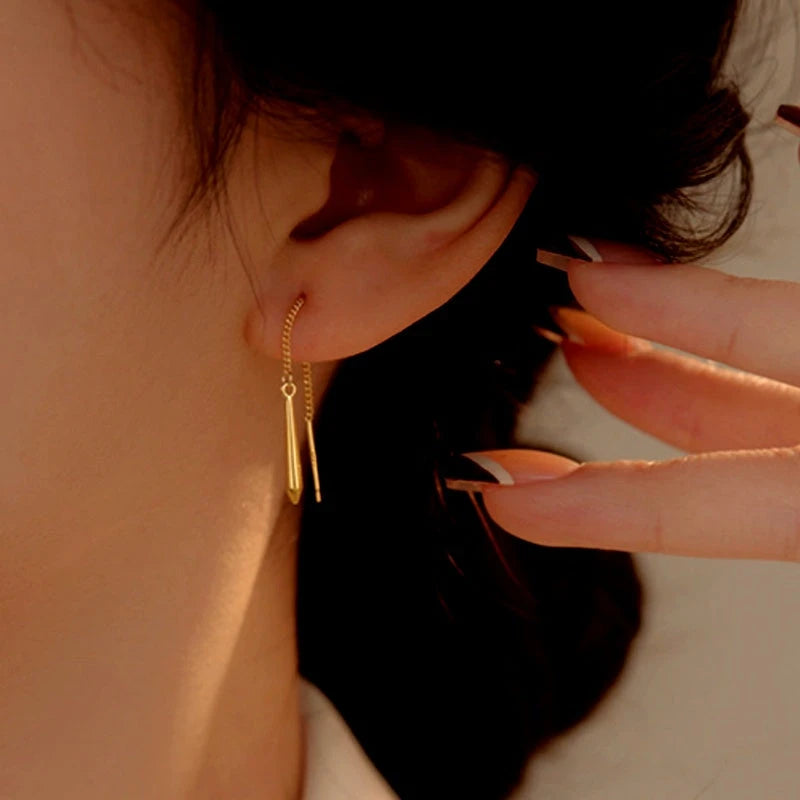 Model showcasing the dangle and style of the Sterling Silver Water Drop Threader Earrings