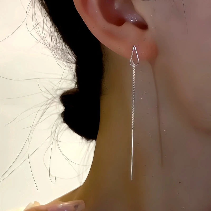 Model showcasing the dangle and style of the Sterling Silver Water Drop Threader Earrings