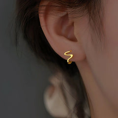 Model showcasing the dangle and style of the Sterling Silver Wave Pattern Earrings