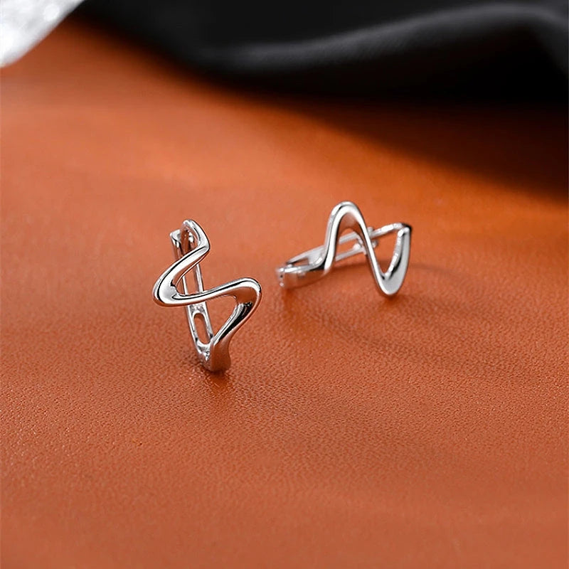 Close-up detail of the sparkling zircons and plating on the Wave Hoop Earrings